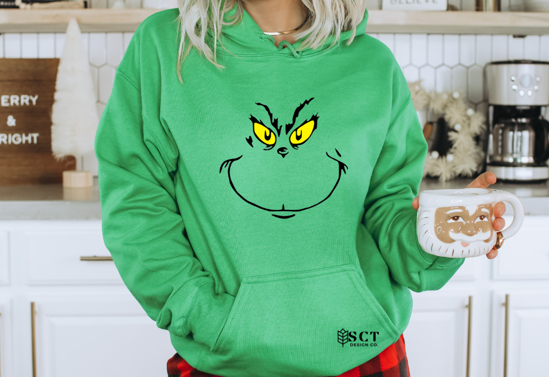 Grinch face sweater hot sale
