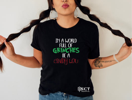 In a world full of Grinches be a Cindy Lou - Unisex Tee